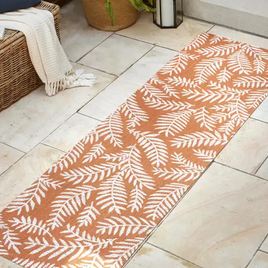 8' Orange And Cream Floral Indoor Outdoor Runner Rug Photo 5