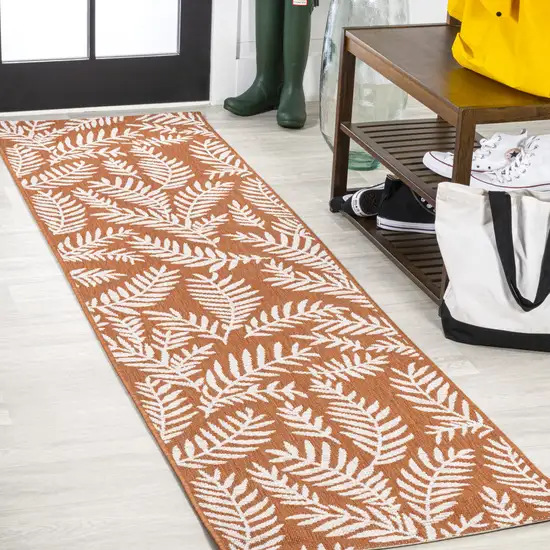 8' Orange And Cream Floral Indoor Outdoor Runner Rug Photo 4