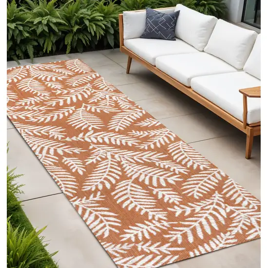 8' Orange And Cream Floral Indoor Outdoor Runner Rug Photo 1