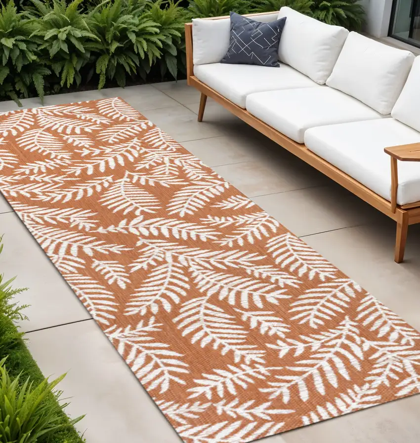 8' Orange And Cream Floral Indoor Outdoor Runner Rug Photo 1