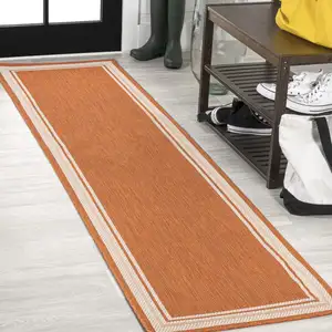 Photo of 8' Orange And Cream Indoor Outdoor Runner Rug
