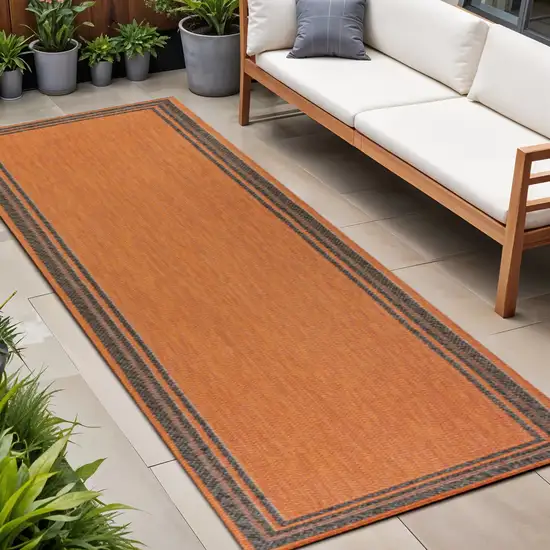 8' Orange And Dark Gray Indoor Outdoor Runner Rug Photo 1