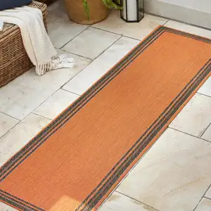 Photo of 8' Orange And Dark Gray Indoor Outdoor Runner Rug