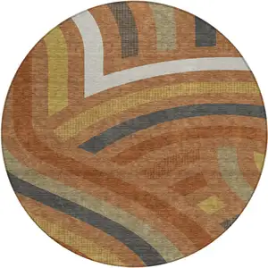 Photo of 8' Orange And Gold Round Abstract Washable Indoor Outdoor Area Rug