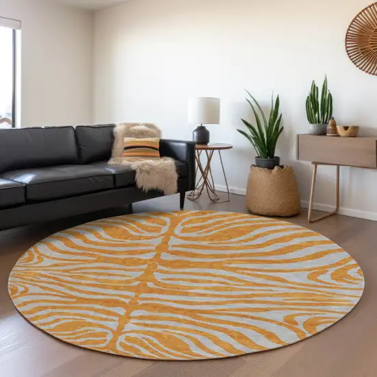 8' Orange And Gray Animal Print Washable Round Rug With UV Protection Photo 4