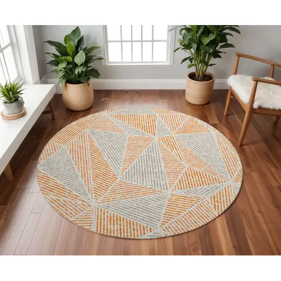 8' Orange And Gray Geometric Washable Round Rug With UV Protection Photo 2