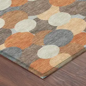 Photo of 8' Orange And Gray Round Geometric Washable Indoor Outdoor Area Rug