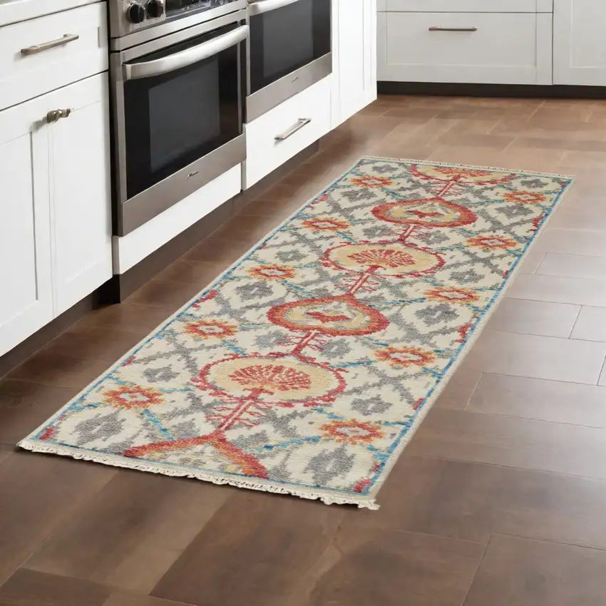 8' Orange and Ivory Wool Floral Hand Knotted Runner Rug With Fringe Photo 1