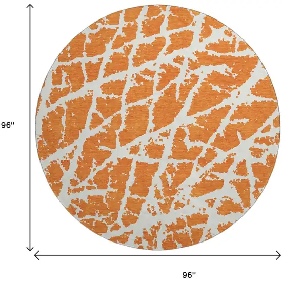 8' Orange And Ivory Abstract Washable Round Rug With UV Protection Photo 3