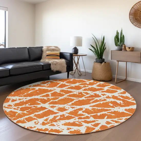 8' Orange And Ivory Abstract Washable Round Rug With UV Protection Photo 5