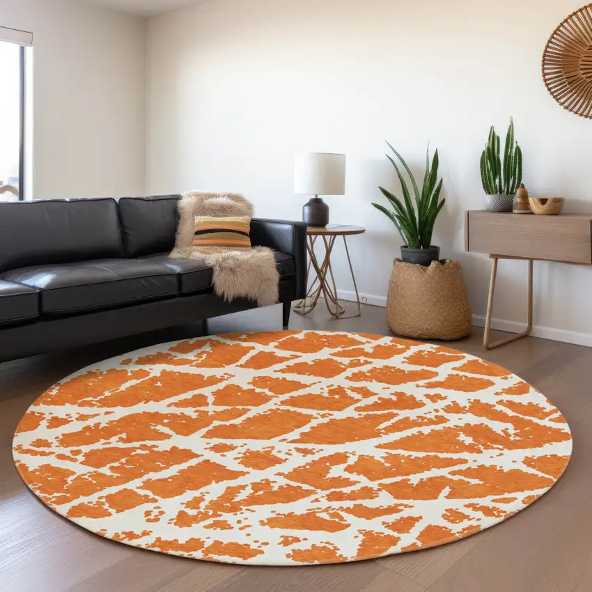 8' Orange And Ivory Abstract Washable Round Rug With UV Protection Photo 5