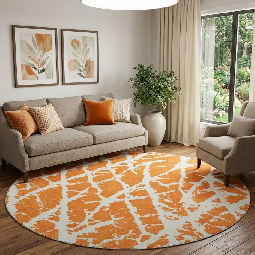8' Orange And Ivory Abstract Washable Round Rug With UV Protection Photo 1
