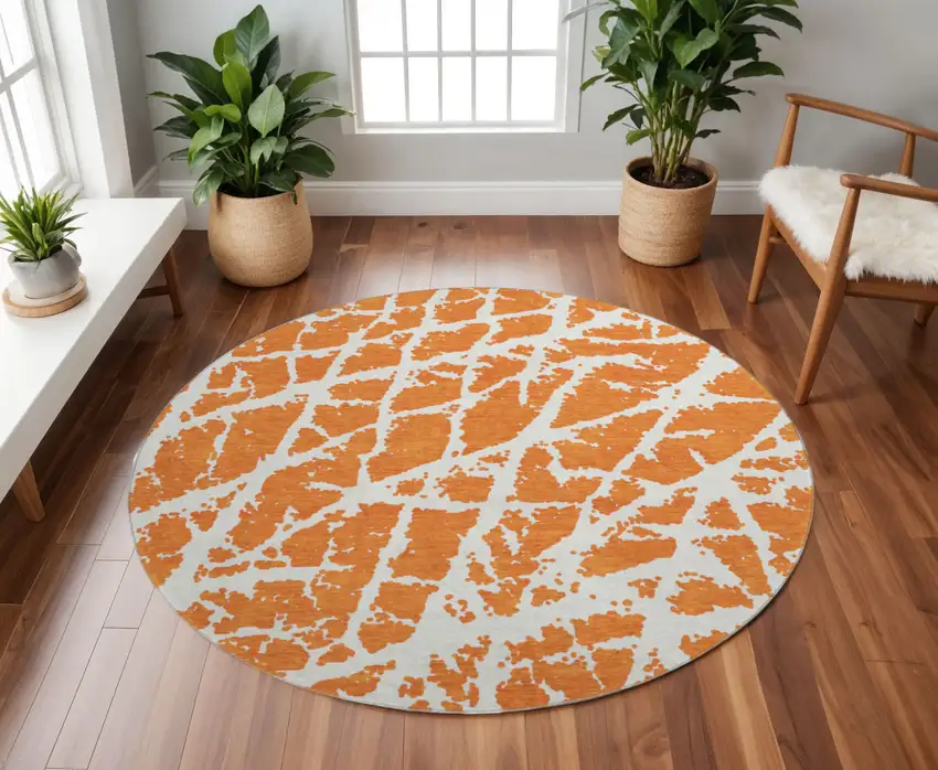 8' Orange And Ivory Abstract Washable Round Rug With UV Protection Photo 2