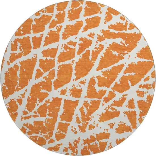 8' Orange And Ivory Abstract Washable Round Rug With UV Protection Photo 1