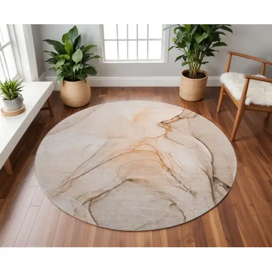 8' Orange And Ivory Abstract Washable Round Rug With UV Protection Photo 2