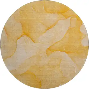 Photo of 8' Orange And Ivory Abstract Washable Round Rug With UV Protection