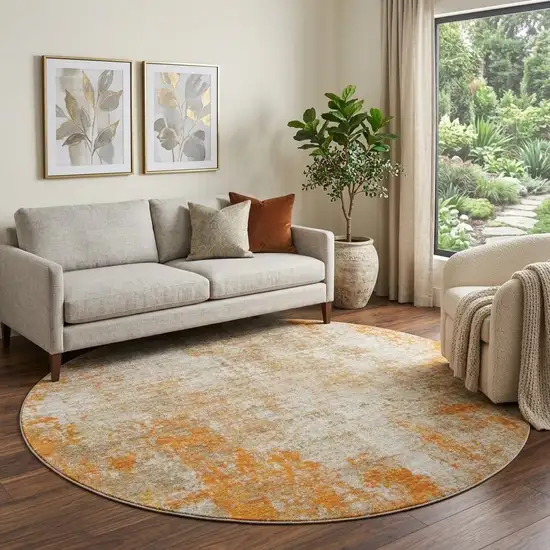 8' Orange And Ivory Abstract Washable Round Rug With UV Protection Photo 1