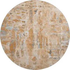 Photo of 8' Orange And Ivory Abstract Washable Round Rug With UV Protection