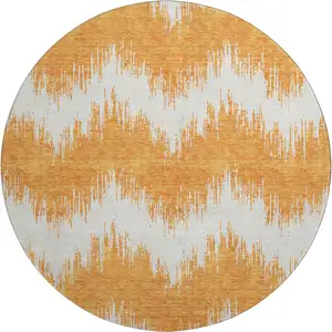 Photo of 8' Orange And Ivory Chevron Washable Round Rug With UV Protection