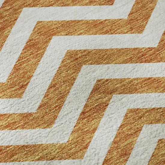 8' Orange And Ivory Chevron Washable Round Rug With UV Protection Photo 9