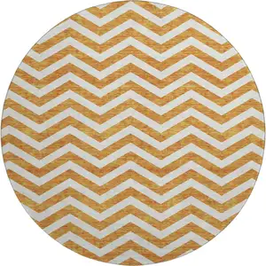 Photo of 8' Orange And Ivory Chevron Washable Round Rug With UV Protection