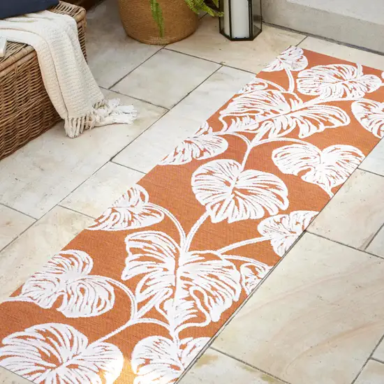 8' Orange And Ivory Floral Indoor Outdoor Runner Rug Photo 5