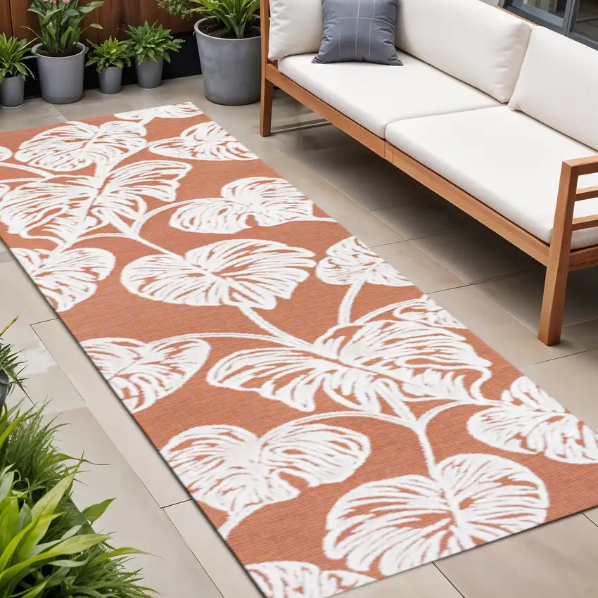 8' Orange And Ivory Floral Indoor Outdoor Runner Rug Photo 1
