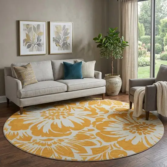 8' Orange And Ivory Floral Washable Round Rug With UV Protection Photo 1
