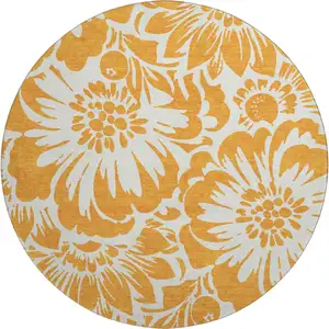 Photo of 8' Orange And Ivory Floral Washable Round Rug With UV Protection