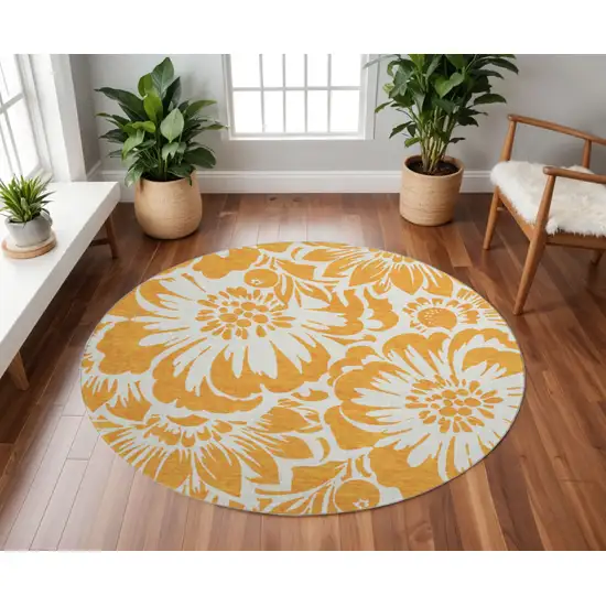 8' Orange And Ivory Floral Washable Round Rug With UV Protection Photo 2