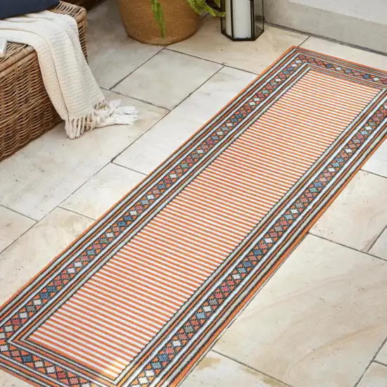 8' Orange And Ivory Geometric Indoor Outdoor Runner Rug Photo 5