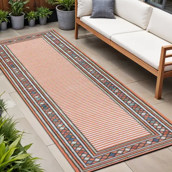 8' Orange And Ivory Geometric Indoor Outdoor Runner Rug Photo 1