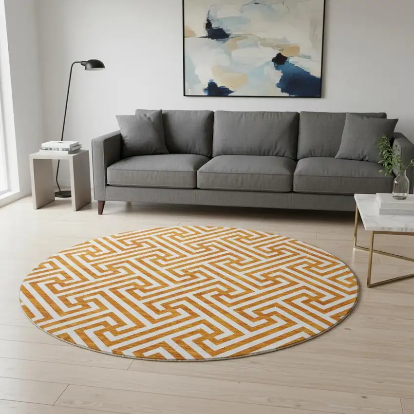 8' Orange And Ivory Geometric Washable Round Rug With UV Protection Photo 2