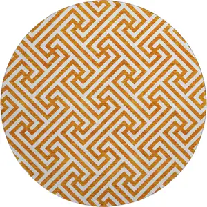 Photo of 8' Orange And Ivory Geometric Washable Round Rug With UV Protection