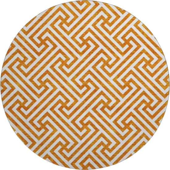 8' Orange And Ivory Geometric Washable Round Rug With UV Protection Photo 1