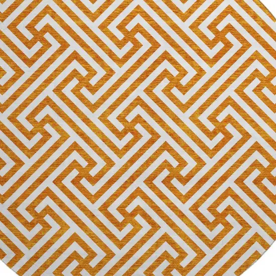 8' Orange And Ivory Geometric Washable Round Rug With UV Protection Photo 3