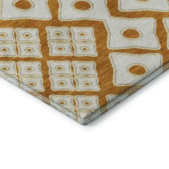 8' Orange And Ivory Geometric Washable Round Rug With UV Protection Photo 8