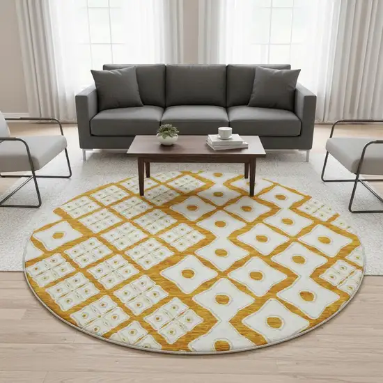 8' Orange And Ivory Geometric Washable Round Rug With UV Protection Photo 1