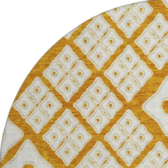 8' Orange And Ivory Geometric Washable Round Rug With UV Protection Photo 4