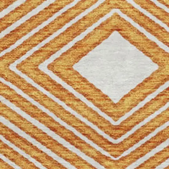 8' Orange And Ivory Geometric Washable Round Rug With UV Protection Photo 3