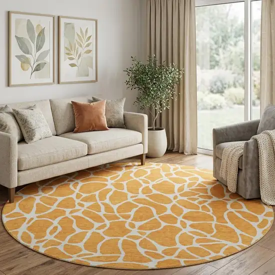 8' Orange And Ivory Geometric Washable Round Rug With UV Protection Photo 1
