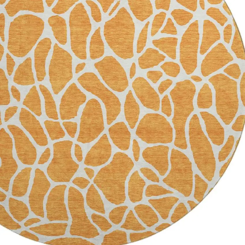 8' Orange And Ivory Geometric Washable Round Rug With UV Protection Photo 2