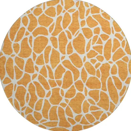 8' Orange And Ivory Geometric Washable Round Rug With UV Protection Photo 4