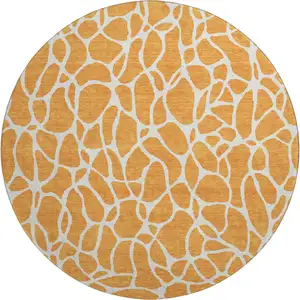Photo of 8' Orange And Ivory Geometric Washable Round Rug With UV Protection