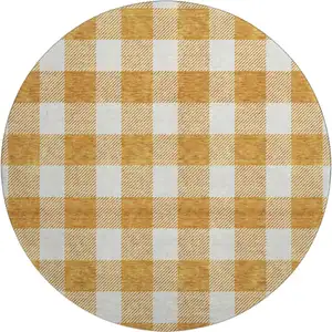 Photo of 8' Orange And Ivory Plaid Washable Round Rug With UV Protection