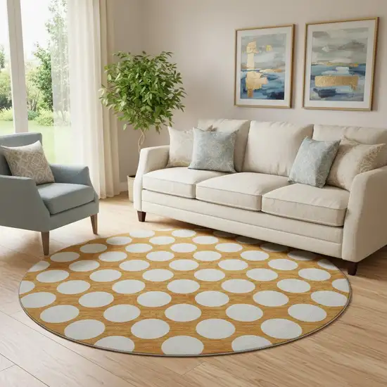8' Orange And Ivory Polka Dot Washable Round Rug With UV Protection Photo 1