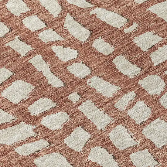 8' Orange And Ivory Round Abstract Washable Indoor Outdoor Area Rug Photo 9