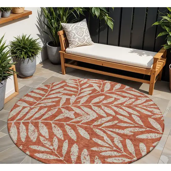 8' Orange And Ivory Round Floral Washable Indoor Outdoor Area Rug Photo 1