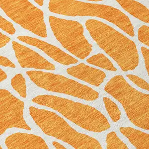 Photo of 8' Orange And Ivory Round Geometric Washable Indoor Outdoor Area Rug
