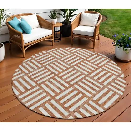 8' Orange And Ivory Round Geometric Washable Indoor Outdoor Area Rug Photo 1